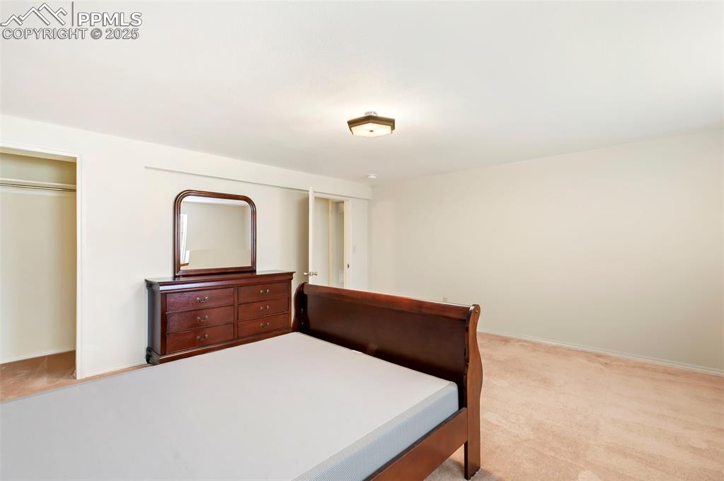 Image 25 of 32: Basement bedroom