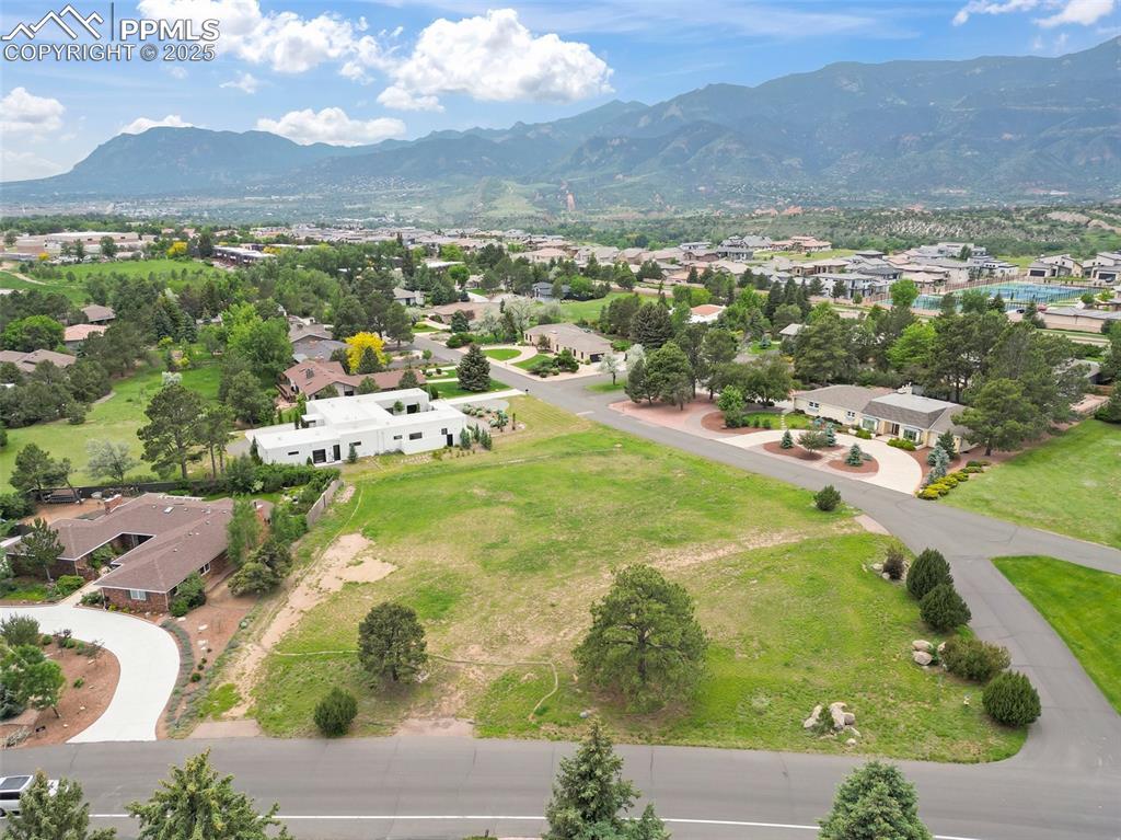 Image 6 of 24: Aerial view of residential area with mountains