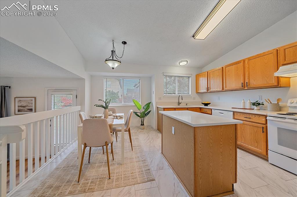 Image 10 of 34: Kitchen With Island, New Granite Countertops