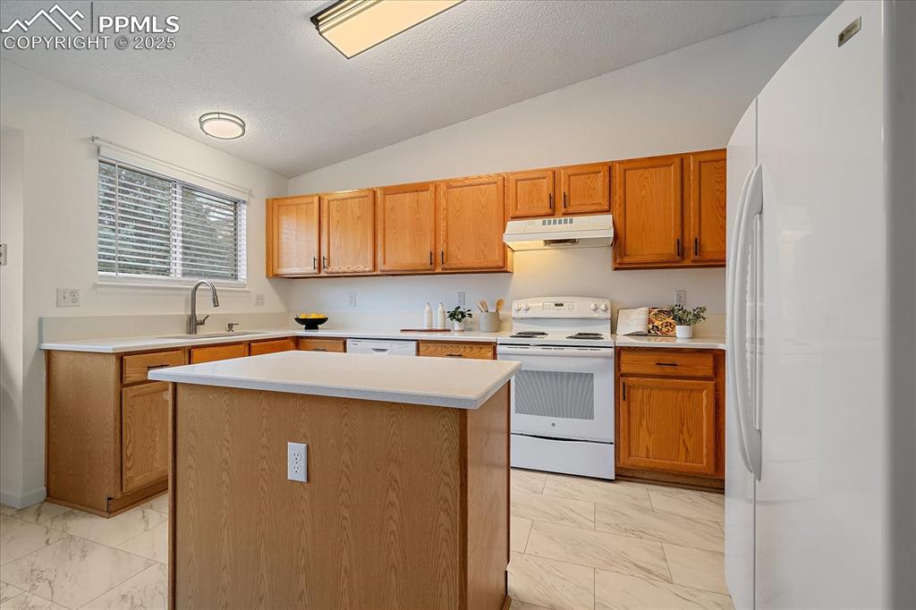 Image 11 of 34: Kitchen With Island, New Granite Countertops