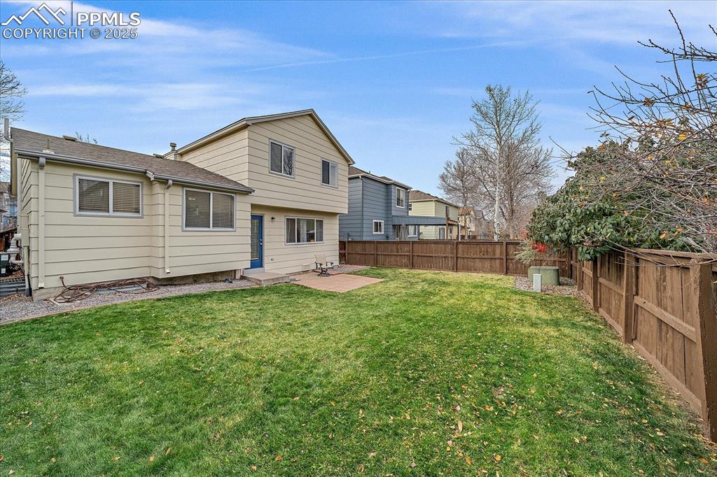 Image 25 of 34: Fenced In Backyard, Privace Fence, Patio