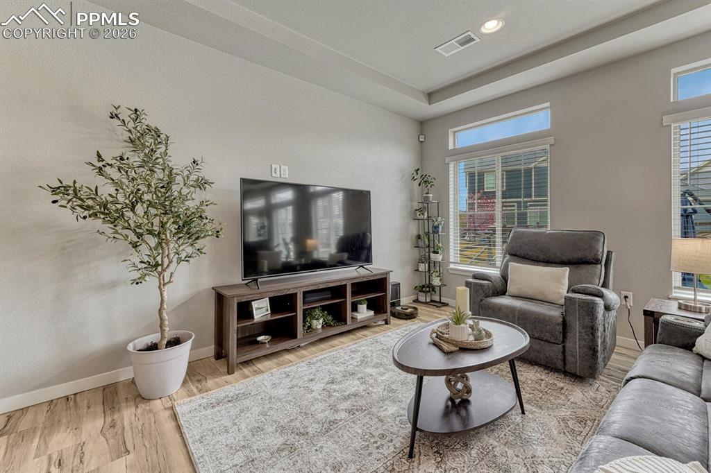 Image 12 of 50: Great Room with backyard views.