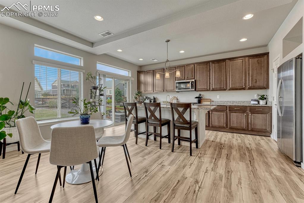 Image 15 of 50: The Dining Area is located adjacent to the Kitchen for easy food serving an