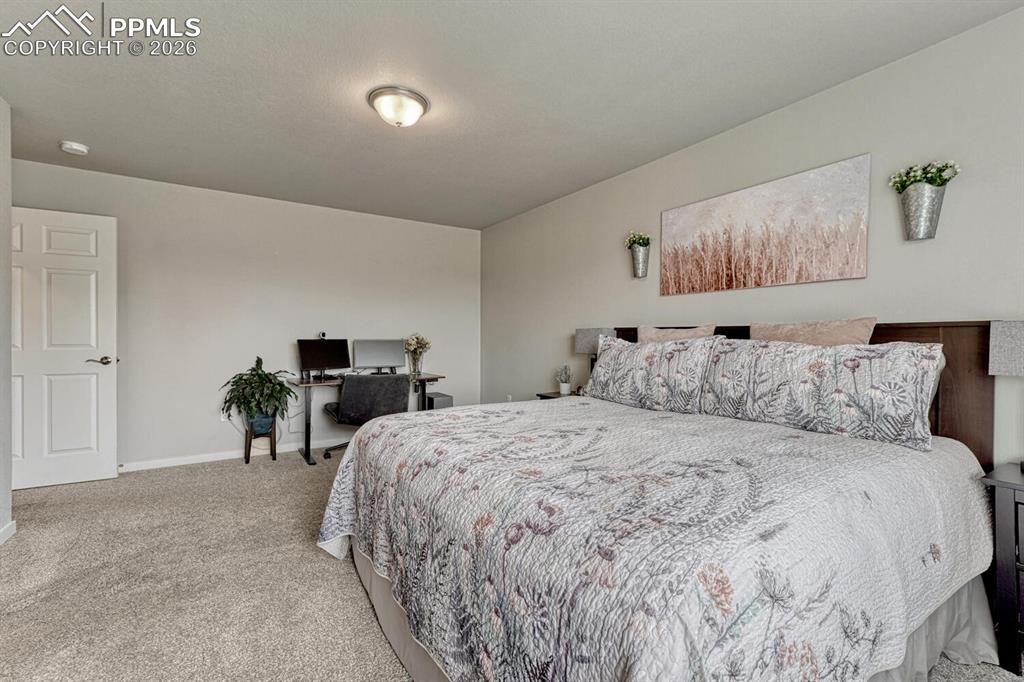 Image 31 of 50: Upper Level Primary Bedroom Suite.