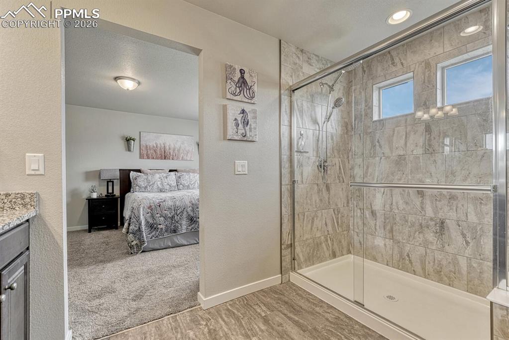 Image 32 of 50: Gorgeous, enclosed tiled shower.