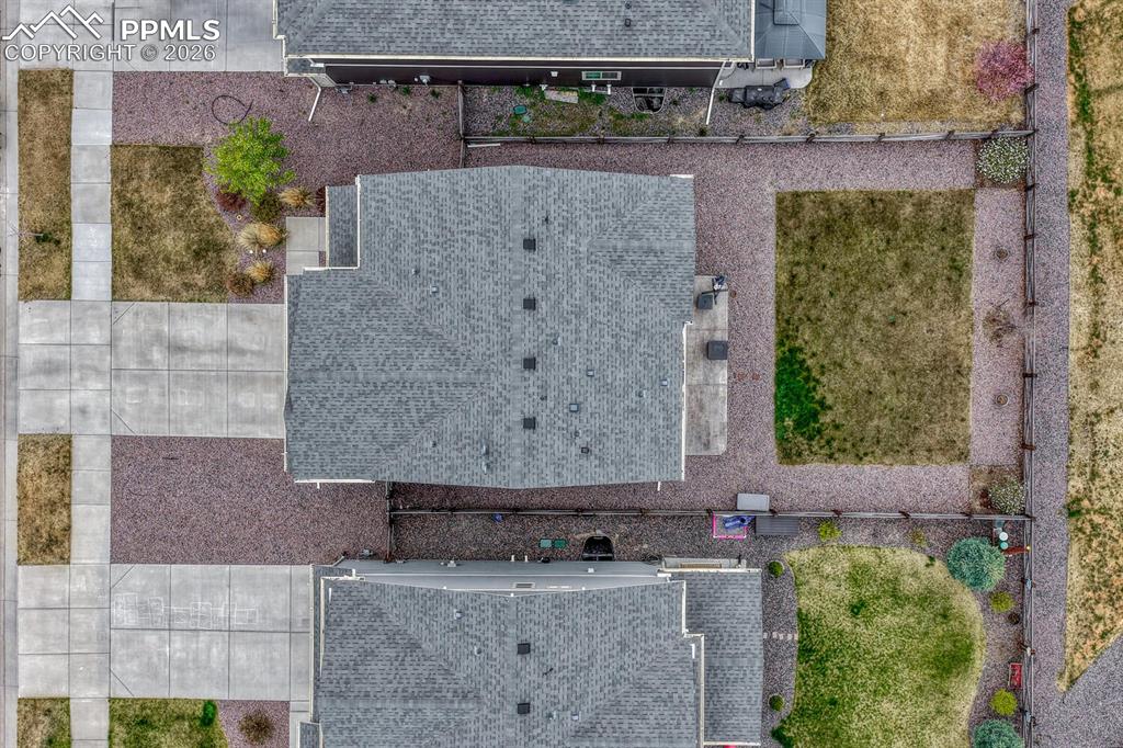 Image 38 of 50: Aerial view of home, roof, and lot.