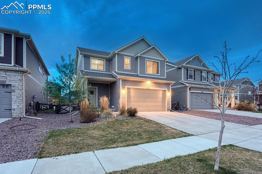 Image 8 of 50: Aerial sunset view of home.
