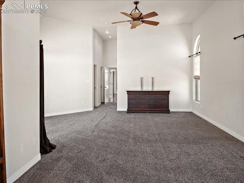 Image 19 of 48: Primary Bedroomand a high ceiling