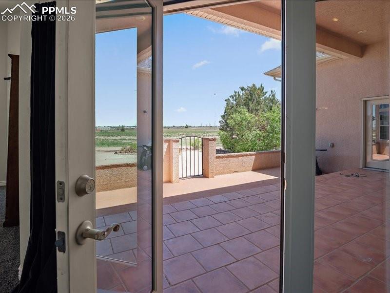 Image 20 of 48: Primary Bedroom to rear patio