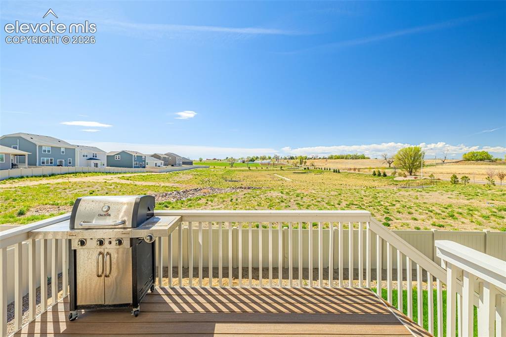 Image 43 of 50: Expansive outdoor deck with composite decking and white railings