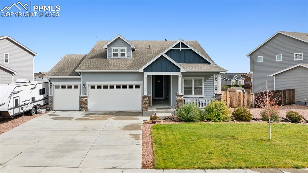 Caption: Craftsman inspired home featuring roof with shingles, board and batten siding, covered porch, concre