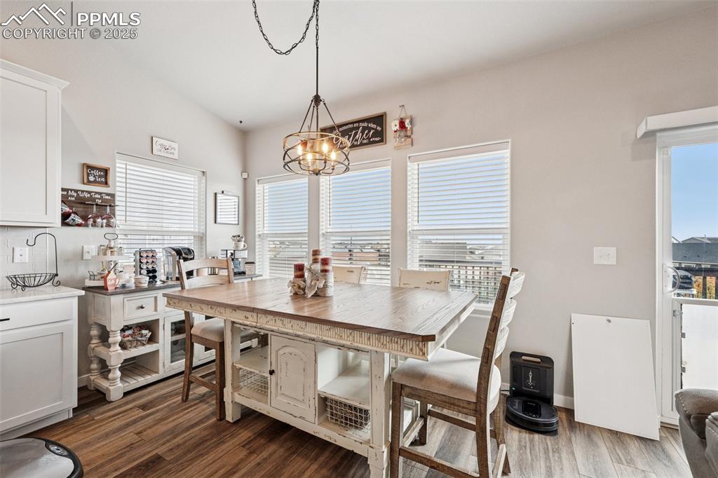 Image 11 of 40: Dining area with attention to detail in the lighting and great views of the