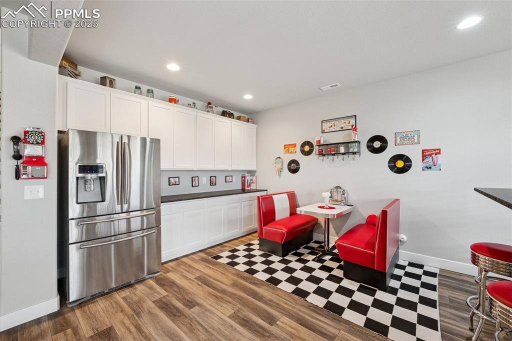 Image 33 of 40: Full sized refrigerator is included with sale.