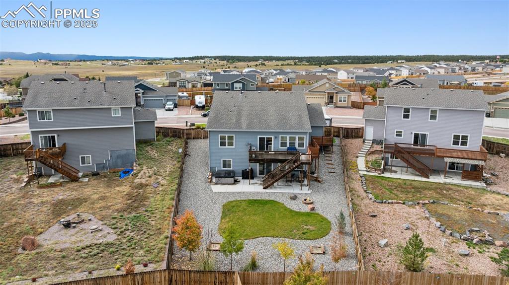 Image 6 of 40: Aerial perspective of quiet suburban area as shown from the rear of the hom