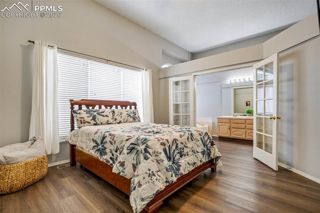 Image 17 of 43: Primary bedroom with bath and walk in closet