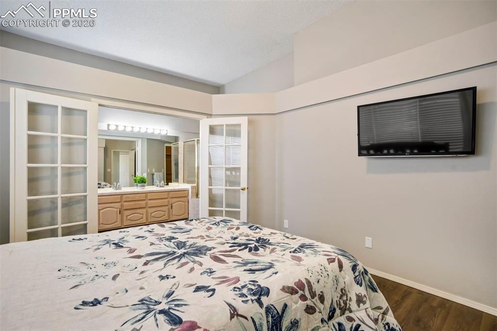 Image 18 of 43: Primary bedroom with bath and walk in closet