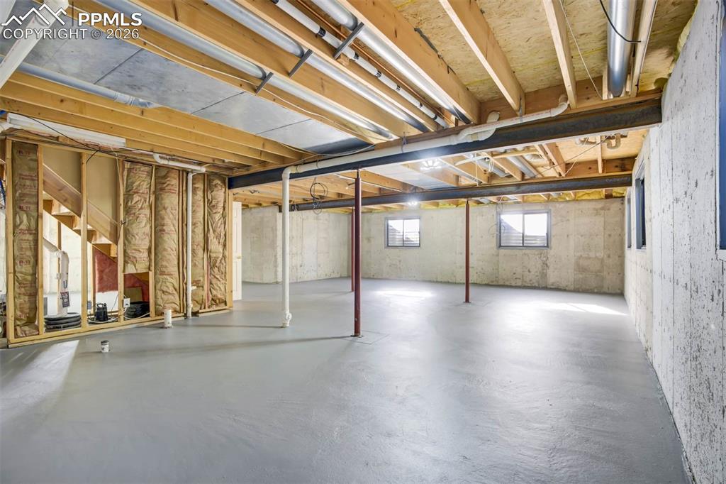 Image 34 of 43: Unfinished basement with rough in