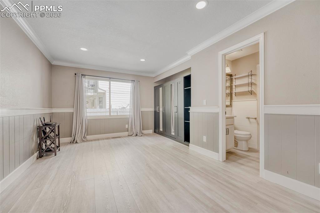 Image 10 of 30: Main floor bedroom