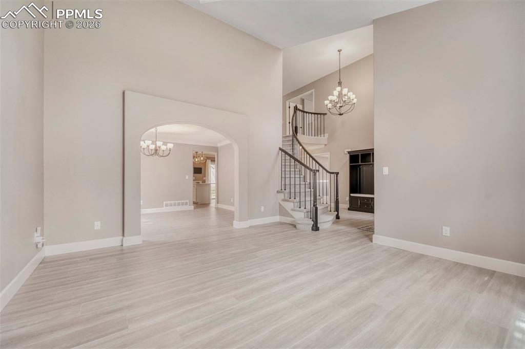 Image 13 of 30: Living room view to foyer