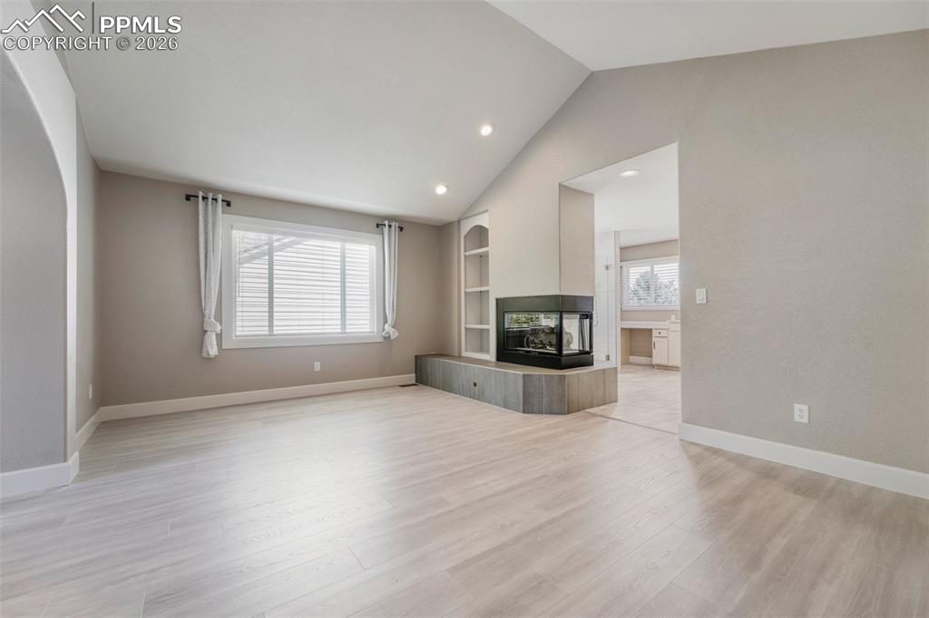 Image 17 of 30: Primary Suite bedroom with view into bathroom
