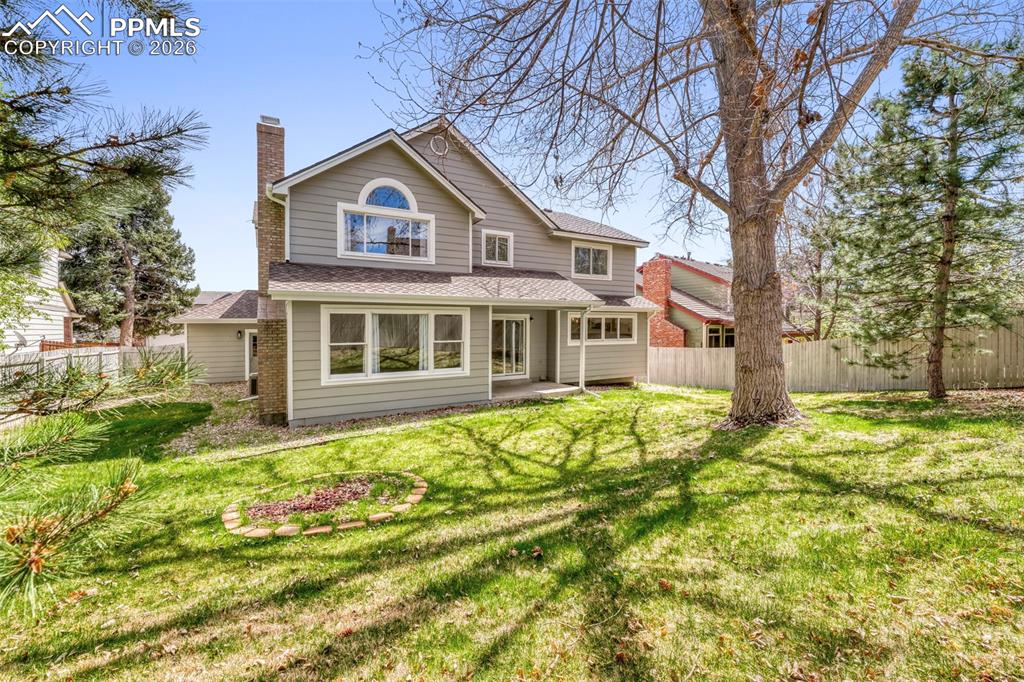 Image 24 of 30: Back yard and rear exterior of house