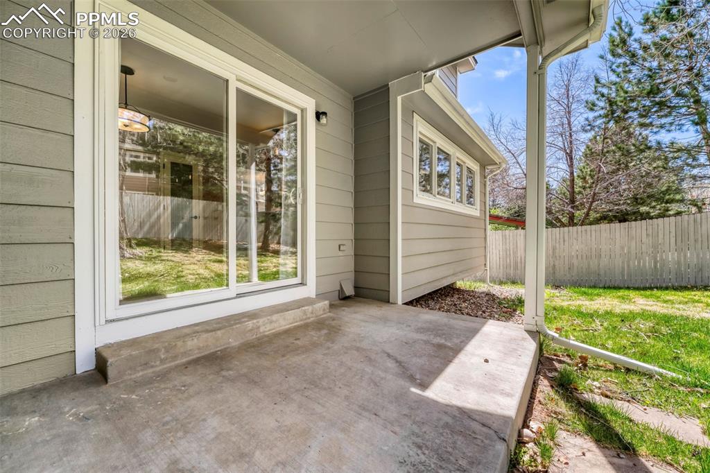 Image 25 of 30: Patio at rear of house