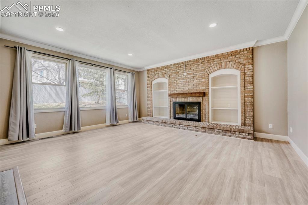 Image 9 of 30: Family Room with gas fireplace