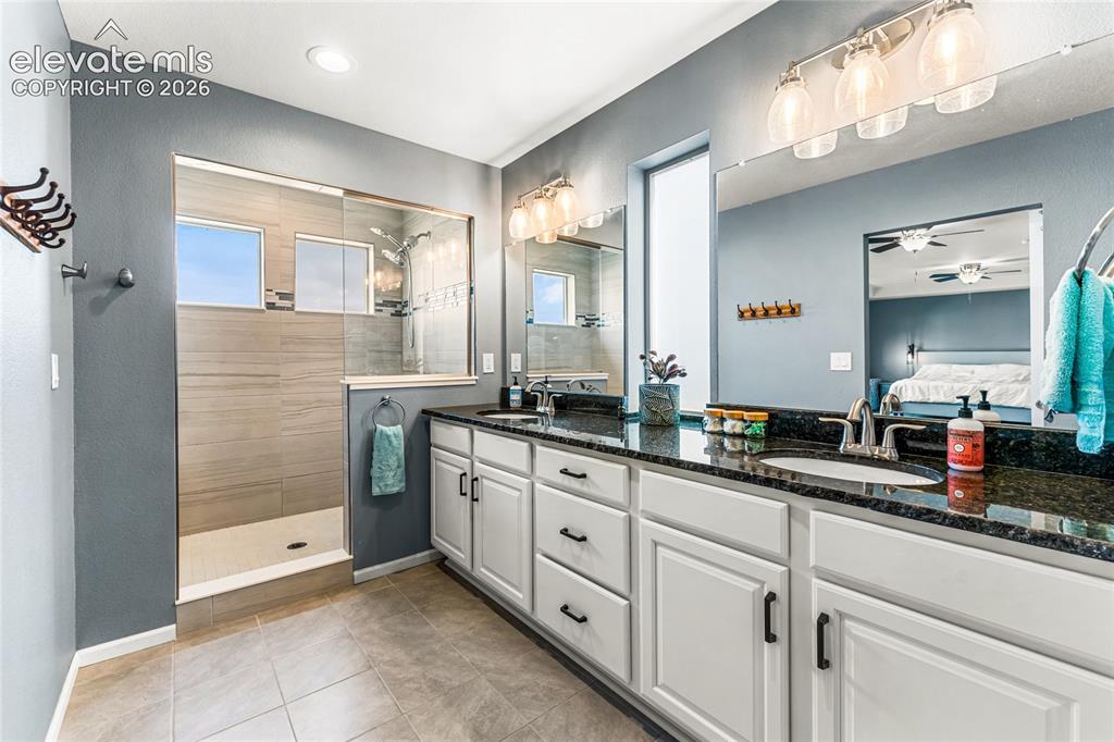 Image 19 of 32: Spacious living area featuring wood-finish flooring, recessed lighting, and