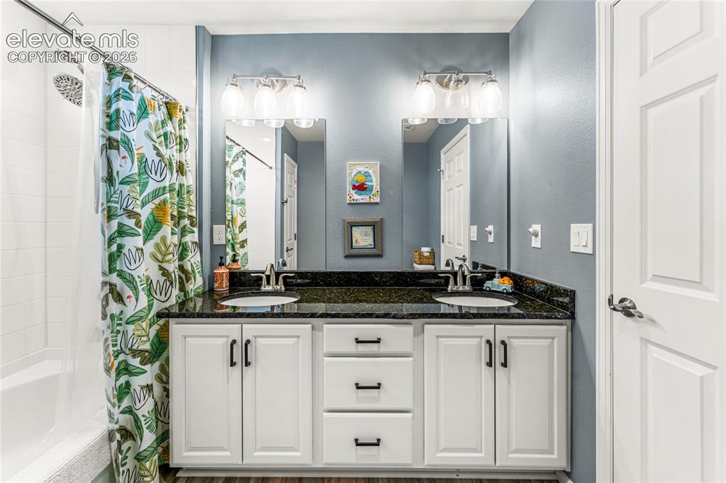 Image 23 of 32: Spacious room featuring neutral carpeting, a ceiling fan with integrated li