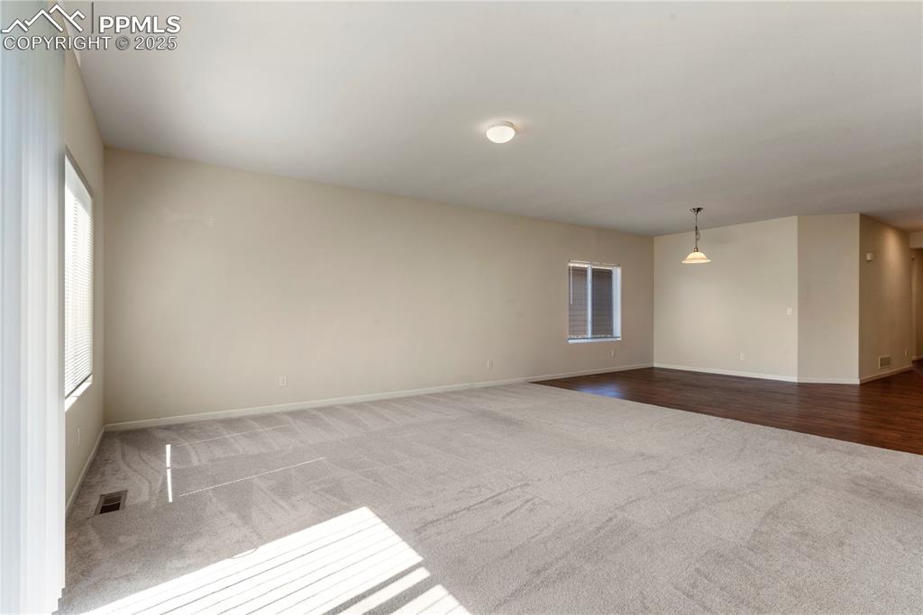Image 21 of 35: Open Concept living room featuring carpet floors, baseboards, and recessed