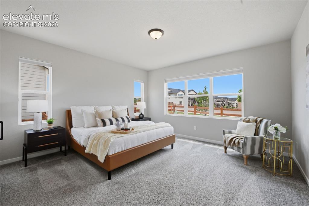 Image 13 of 33: Spacious main level private master bedroom retreat!