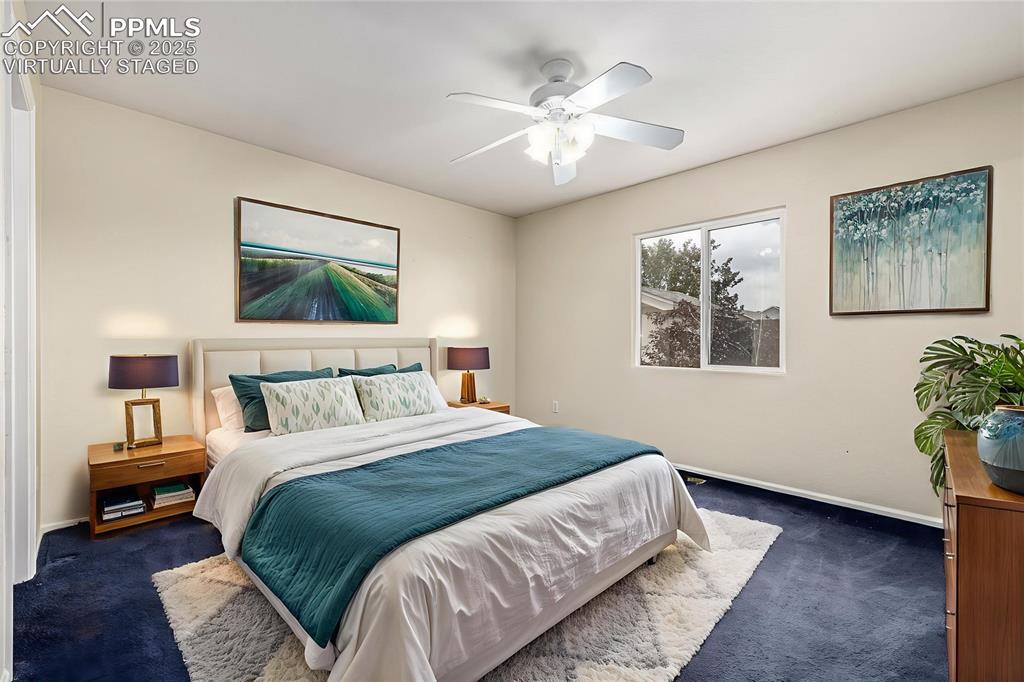Image 13 of 26: Virtually Staged - The spacious primary bedroom has an ensuite bathroom and