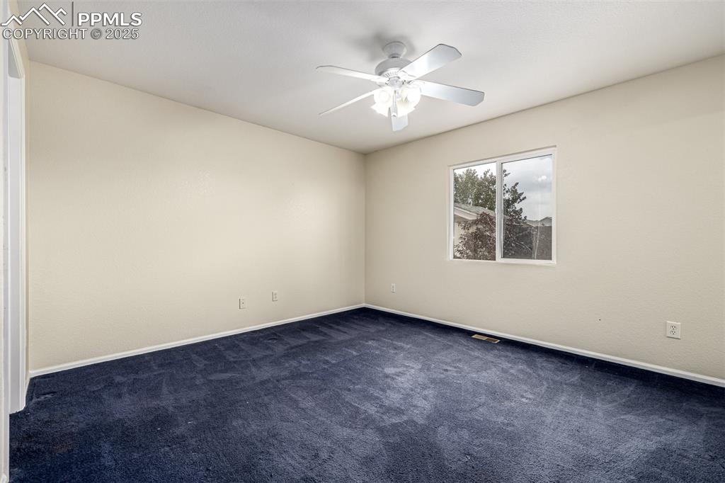 Image 14 of 26: The spacious primary bedroom has an ensuite bathroom and large walk in clos