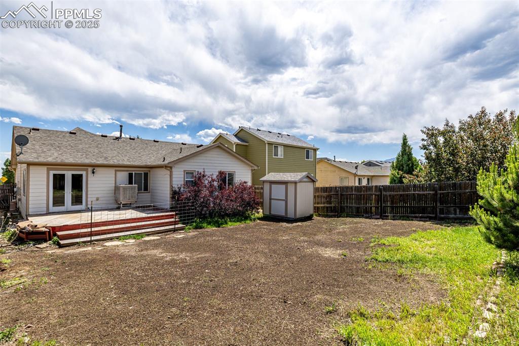 Image 24 of 26: Spacious backyard with new grass growing soon!
