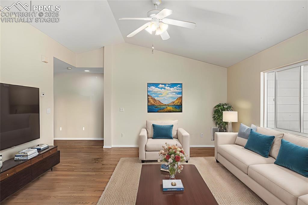 Image 6 of 26: Virtually Staged - The living room features ample natural lighting, hardwoo