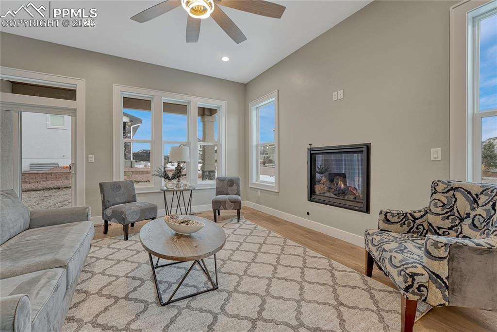 Image 14 of 50: Main Level Living Room w Gas Fireplace