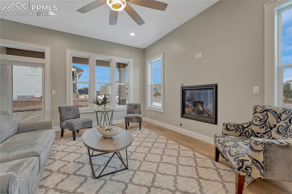 Image 14 of 50: Main Level Living Room w Gas Fireplace