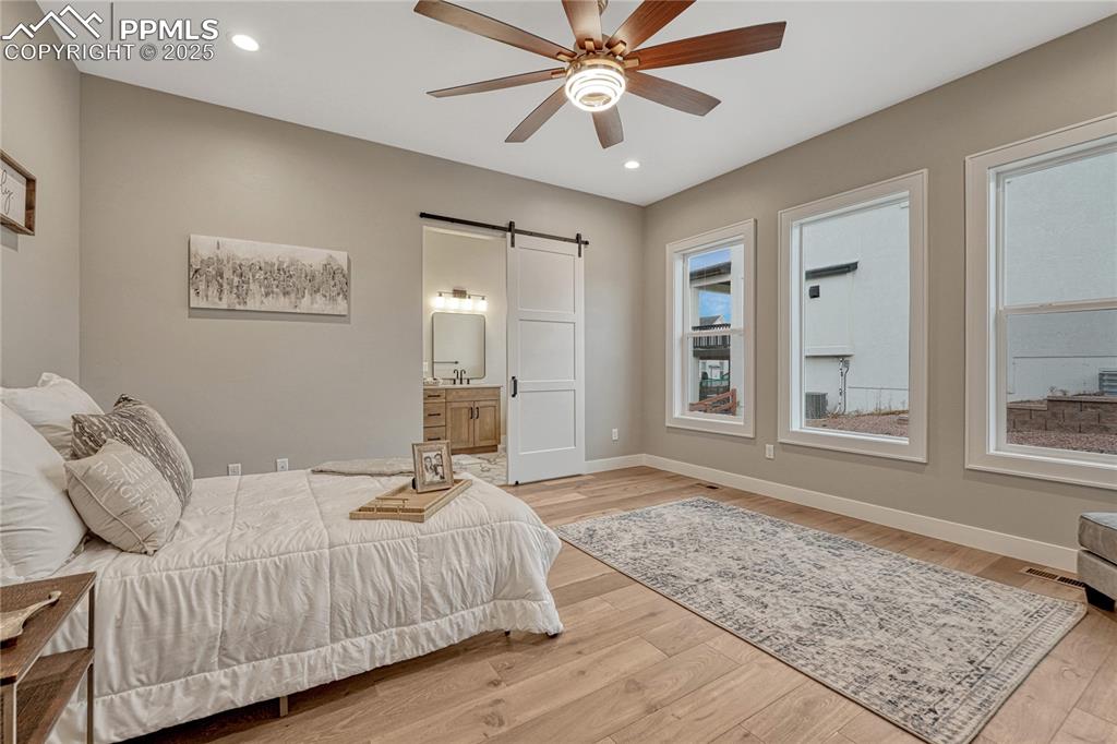 Image 18 of 50: Main Level- Master Bedroom w Adjoining Bathroom