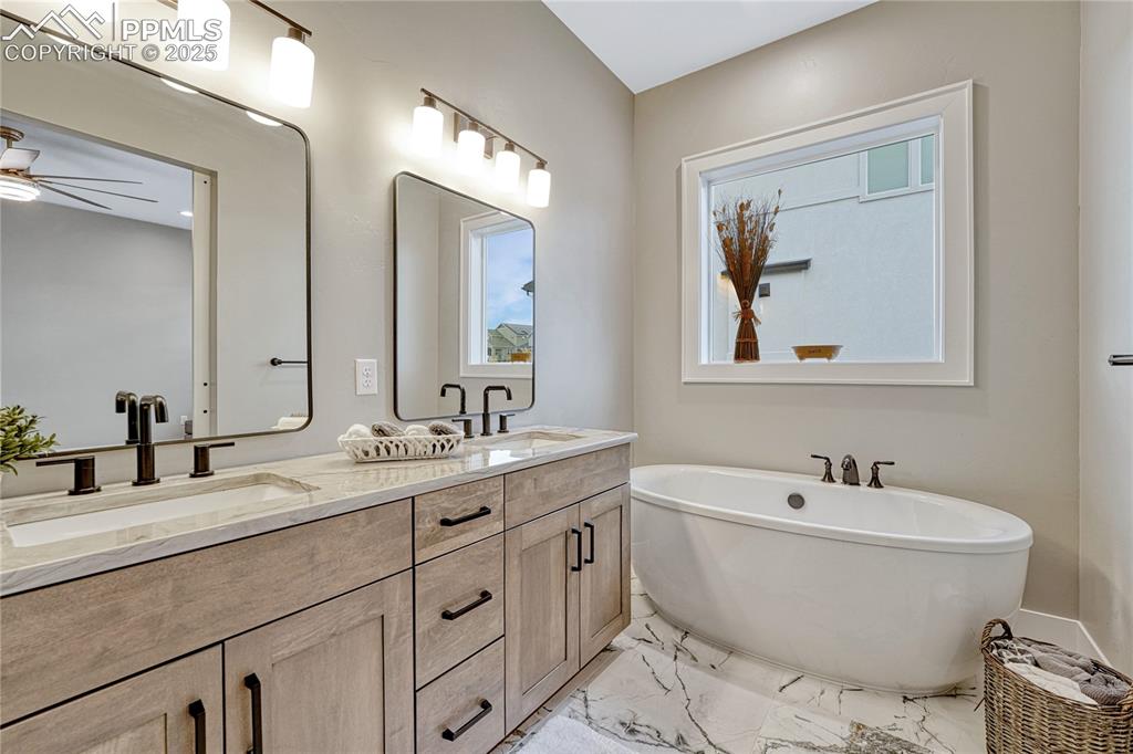 Image 21 of 50: Master Bathroom with Separate Tub