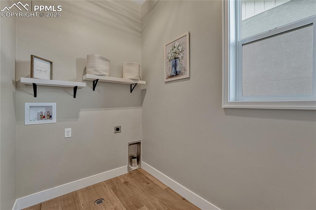 Image 24 of 50: Main Level- Laundry Room with Window