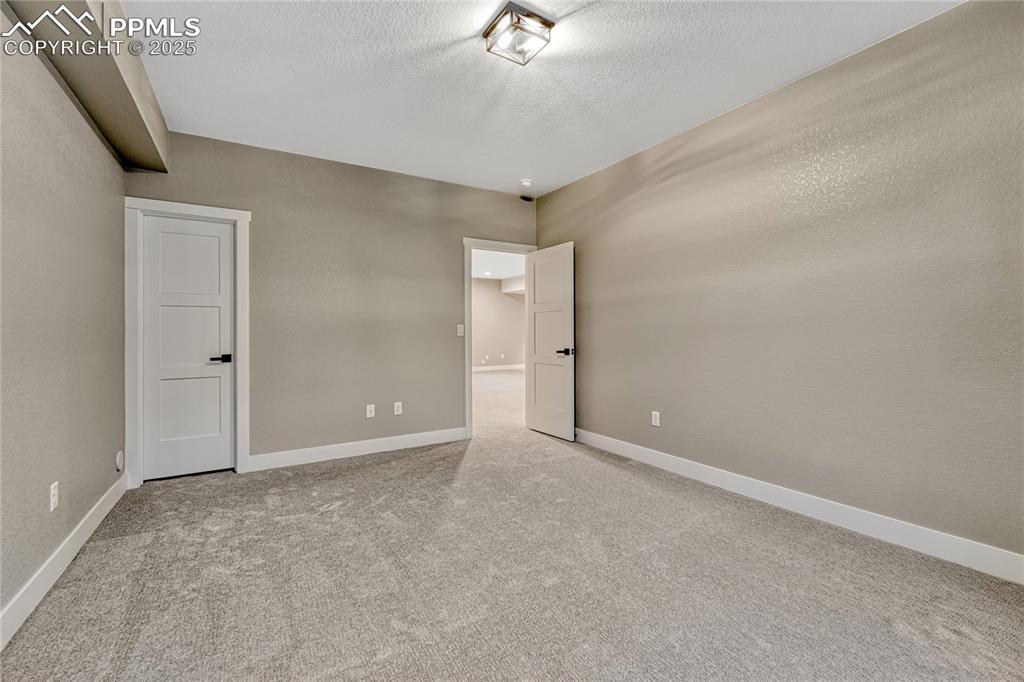 Image 40 of 50: Basement-2nd Bedroom