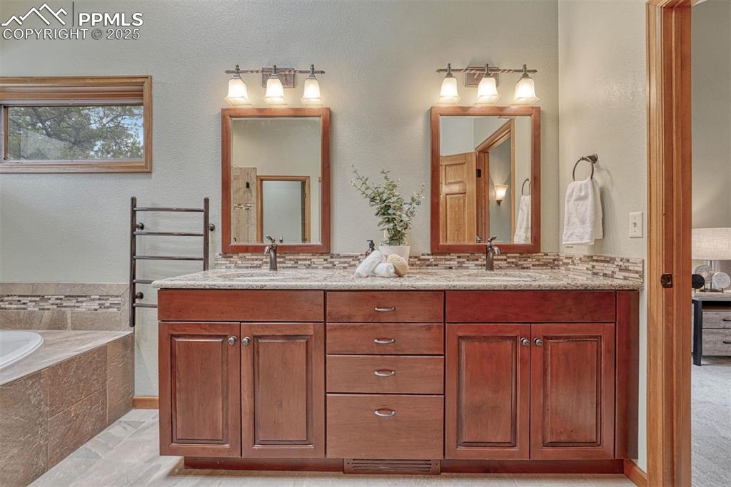 Image 21 of 46: Heated towel bar.