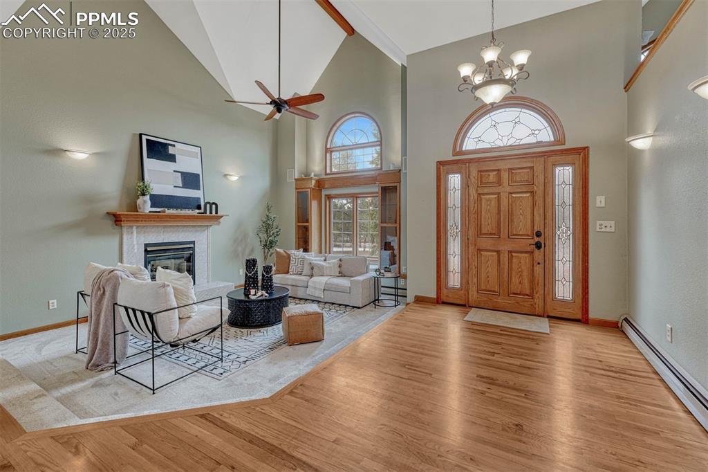 Image 6 of 46: New carpet. Solid Oak floors. Gas fireplace.