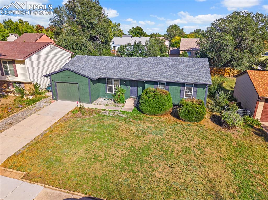 Image 29 of 38: Aerial view of the house and landscaping