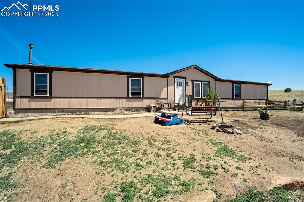 Image 3 of 50: Manufactured / mobile home featuring fence