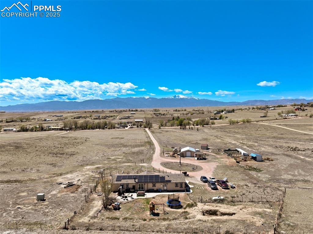 Image 48 of 50: Birds eye view of property featuring a mountain view and a rural view