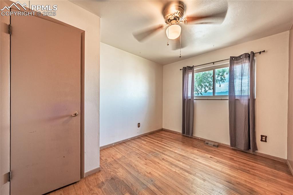 Image 26 of 31: bedroom featuring light wood-style flooring and a ceiling fan