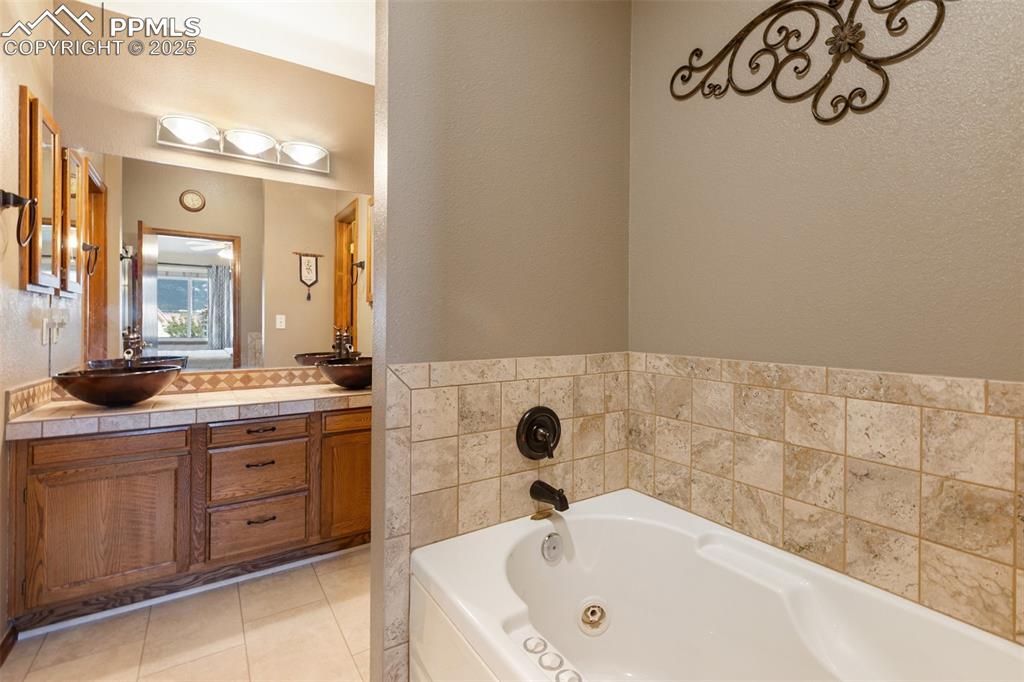 Image 16 of 43: Primary Bathroom with Jacuzzi tub