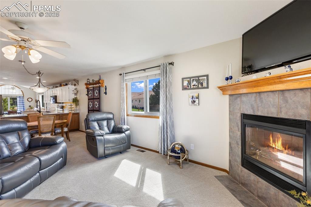 Image 3 of 43: Living room with gas fireplace
