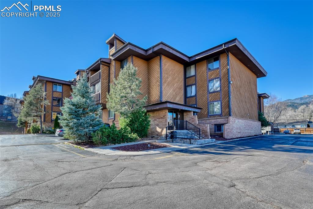 Image 1 of 31: View of property featuring uncovered parking and a mountain view